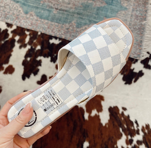 Our Checker flats are the hottest sandal of the season! We are loving the blue and white chess print & we know you will too! Add these to your wardrobe for a cute, casual & chic look!