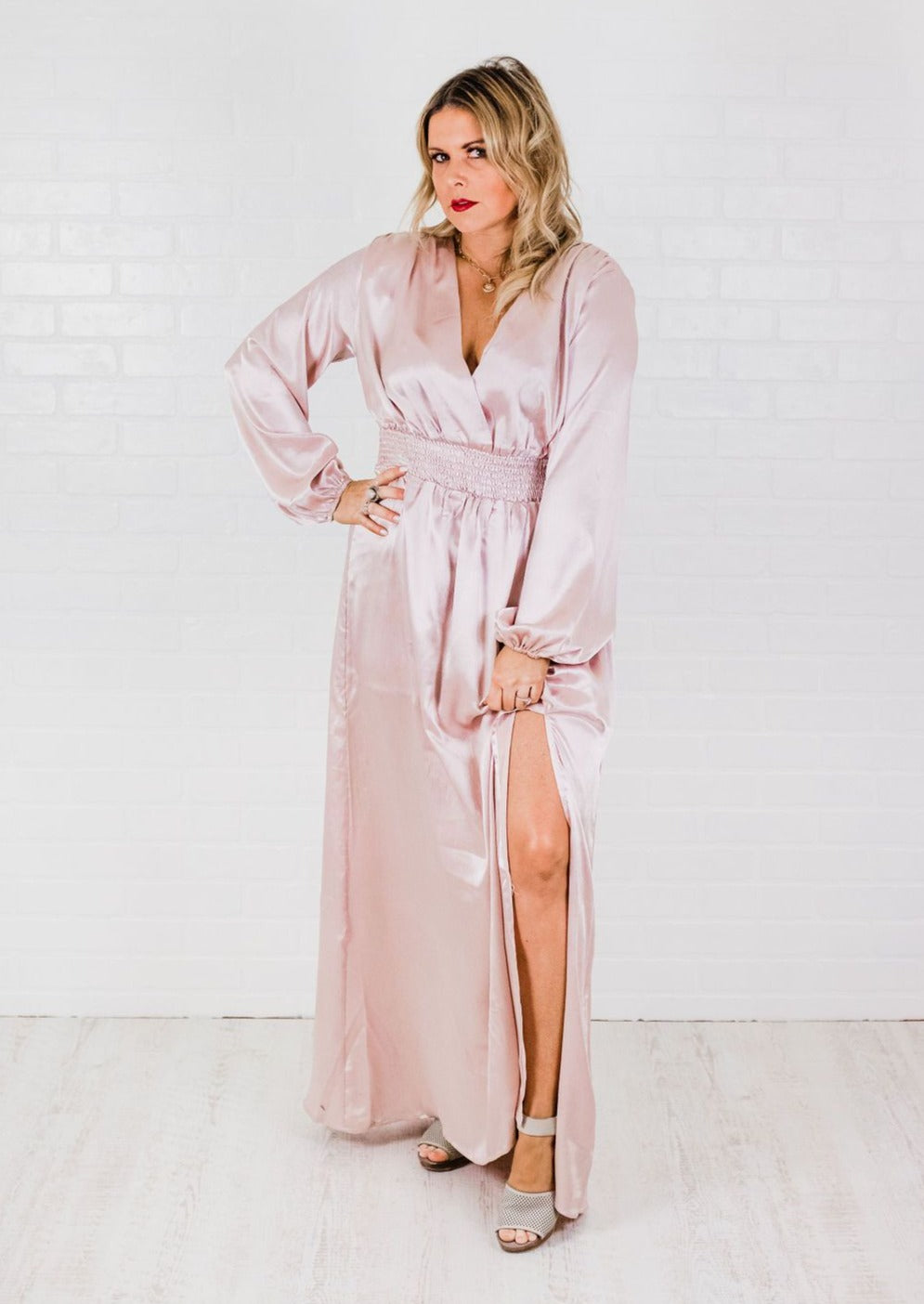 Our ‘Blush Champagne Dress’ is elegant and classy. We love the way the fabric flows and drapes. This dress features a surpluses neckline and smocked waist. Chic styles for the modern woman.